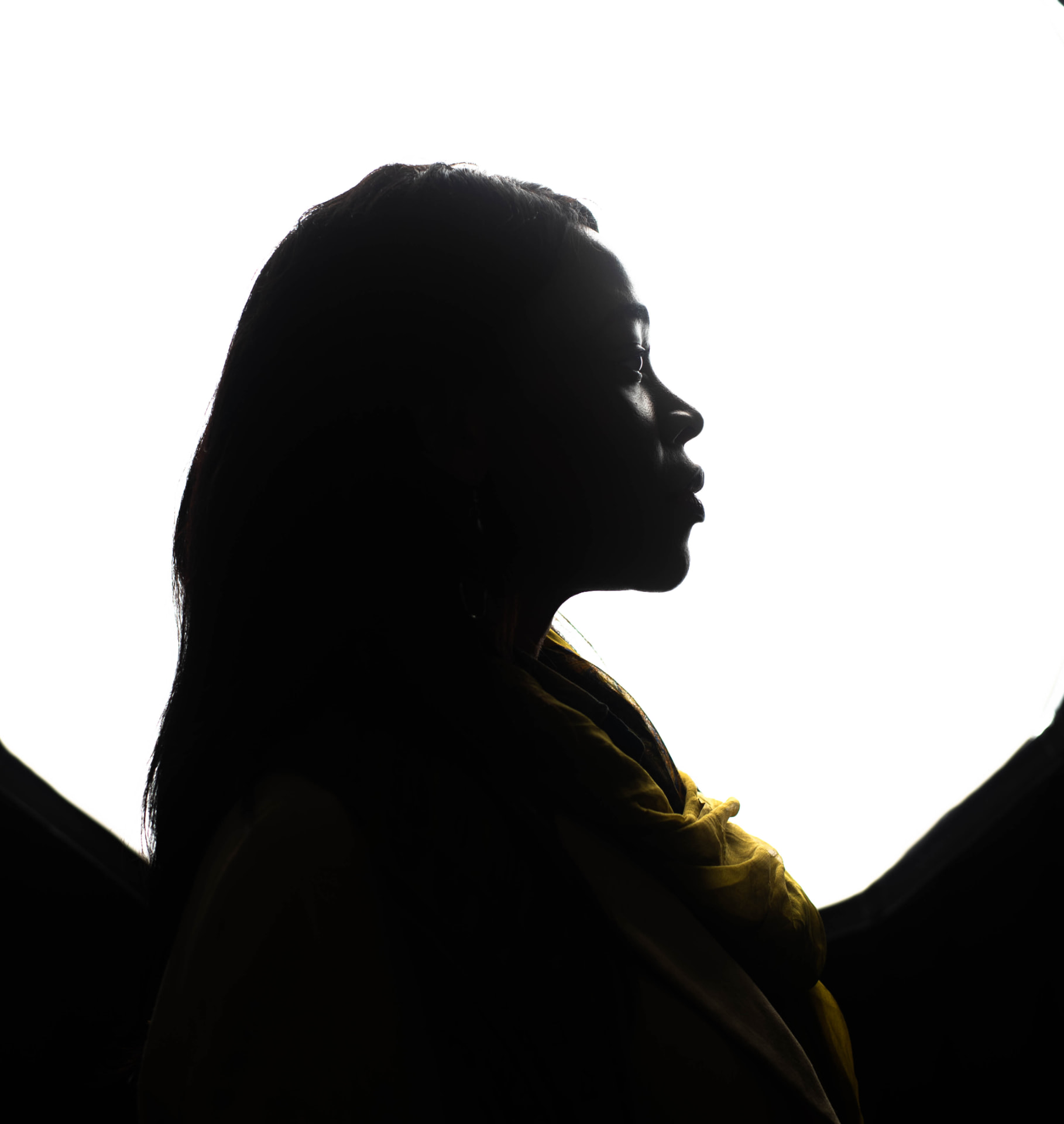 Amabelle in profile, silhouetted against bright light, in a moment of reflection